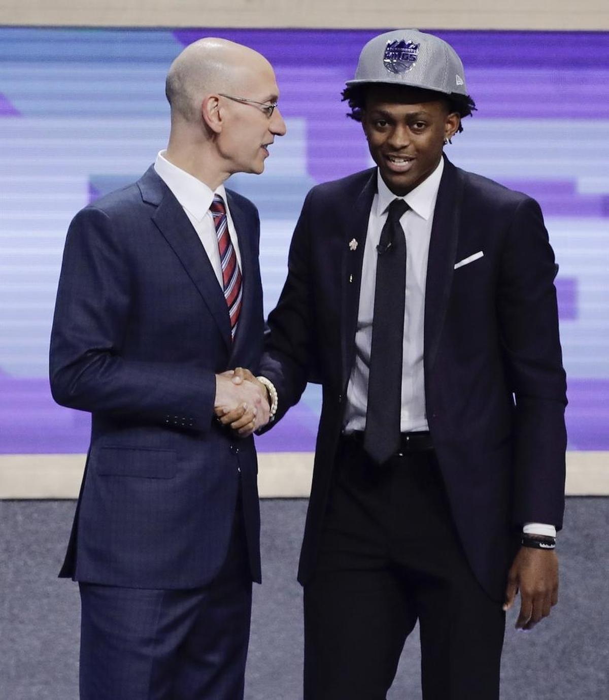 NBA Commissioner Adam Silver, left, and UK’s De’Aaron Fox, one of many one-and-done players in this year’s draft.