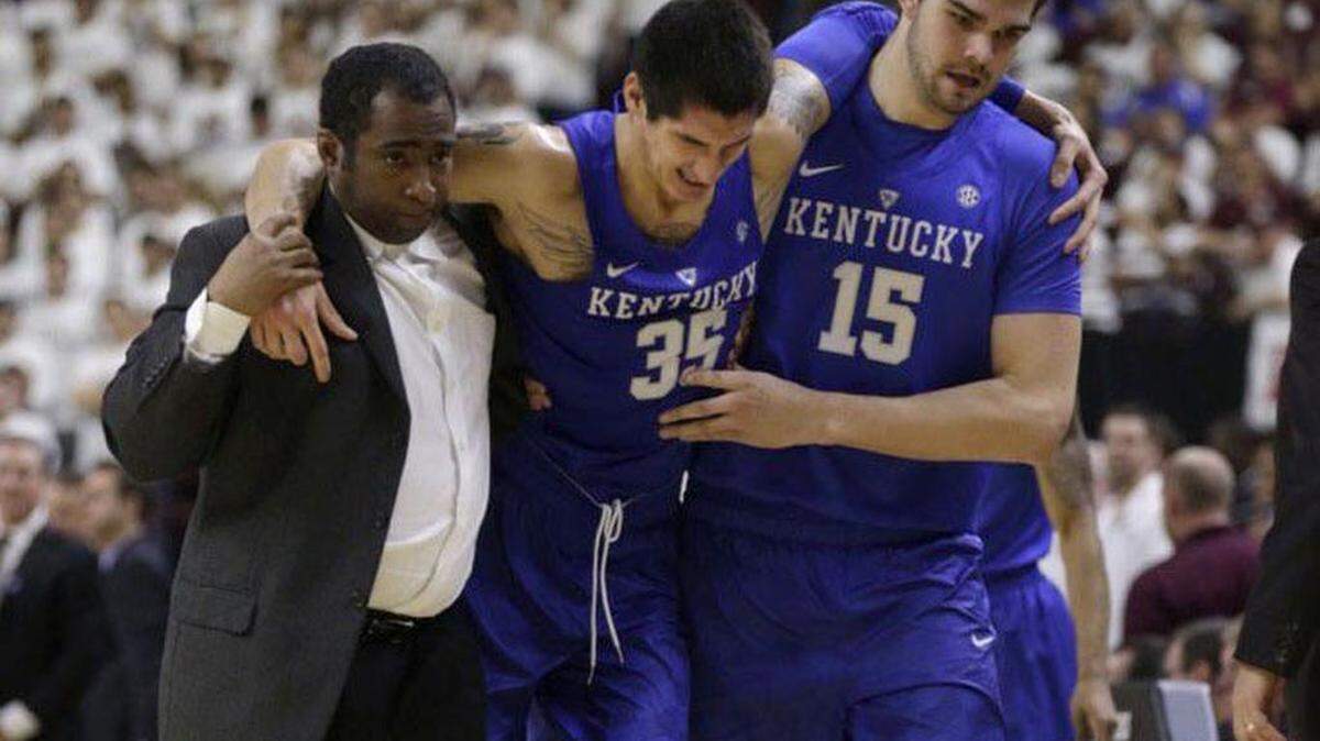 Kentucky forward Derek Willis was helped off court after an ankle injury in the second half. He did not return.