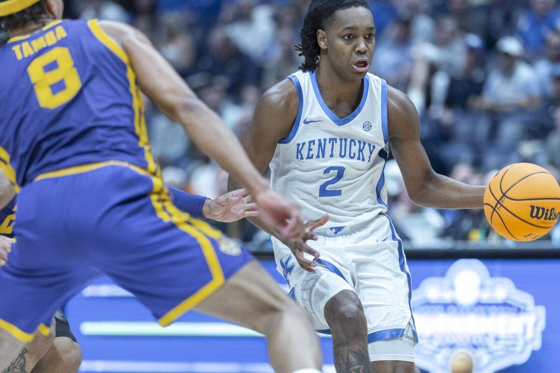 Kentucky Wildcats guard Jasper Johnson (2) moves th ball as Louisiana State Tigers forward Pablo Tamba (8) defends during the SEC Tournament at Bridgestone Arena in Nashville, Tenn., on Wednesday March 11, 2026. 