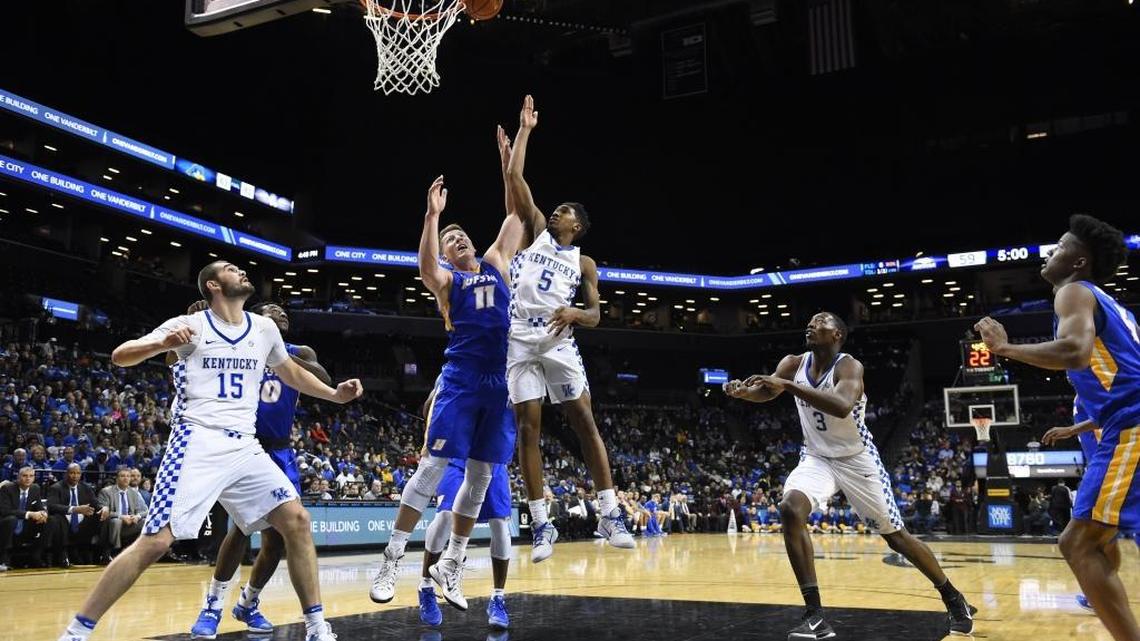 Kentucky guard Malik Monk drove to the basket past Hofstra center Rokas Gustys (11) as teammates Isaac Humphries (15) and Bam Adebayo (3) positioned themselves for a rebound Sunday.