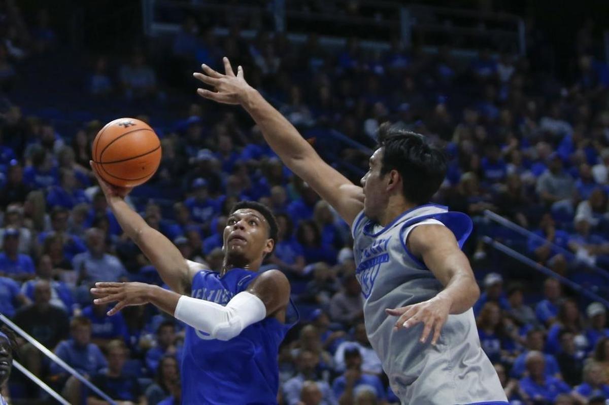 Kentucky point guard Quade Green put up a shot over forward Tai Wynyard during the Blue-White game last month.