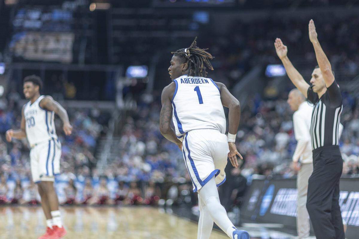 Kentucky Wildcats guard Denzel Aberdeen (1) reacts after scoring a 3-point basket during the first round of the NCAA men’s basketball tournament at Enterprise Center in St. Louis, Mo., on Friday, March 20, 2026.