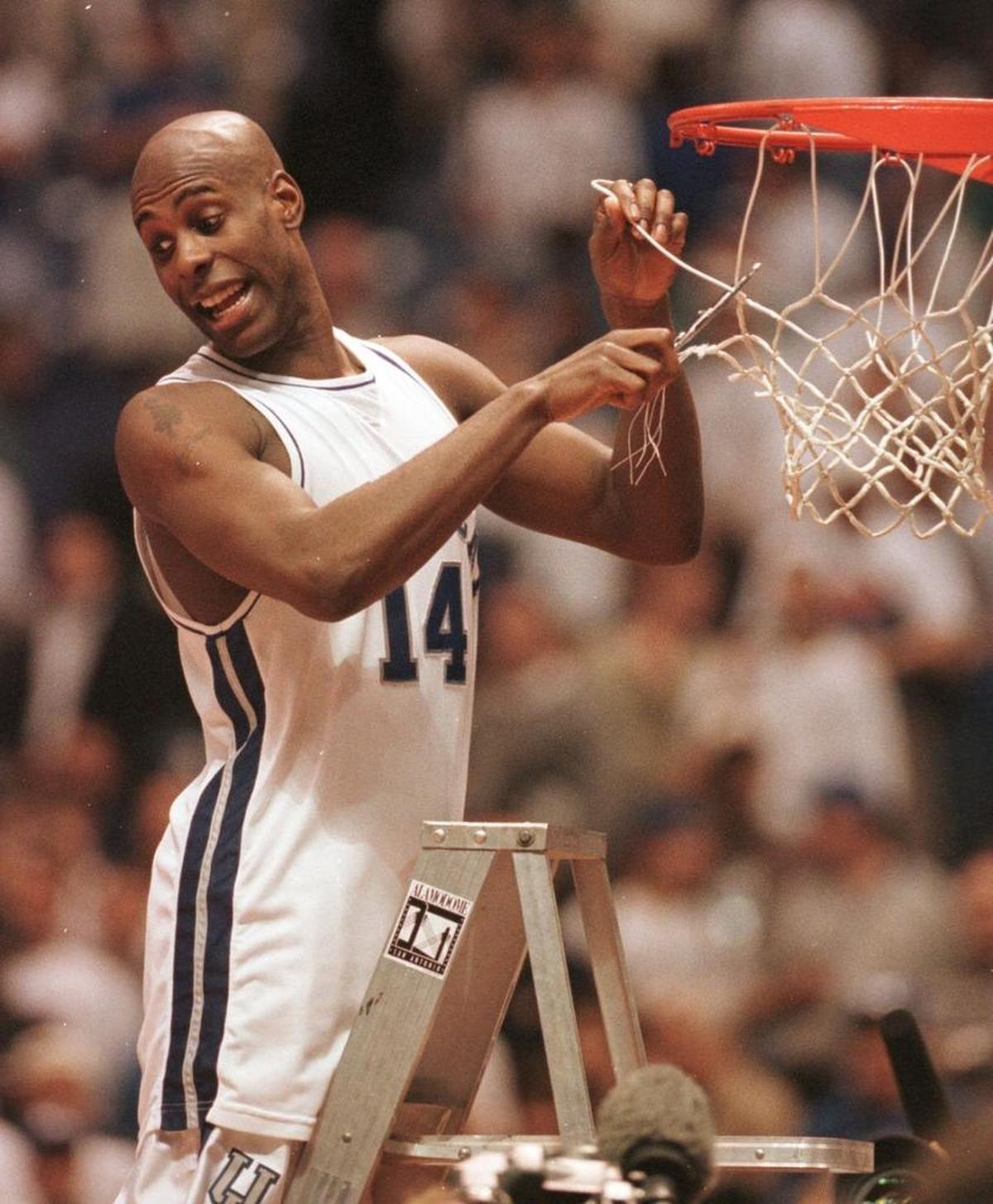 Heshimu Evans helped cut down a net after Kentucky defeated Utah to win the national championship in 1998.