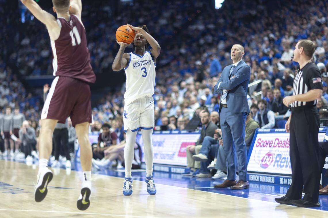 Kentucky Wildcats guard Kam Williams (3) shoots a 3-pointer past Bellarmine Knights forward Brian Waddell (11) during a game at Rupp Arena in Lexington, Ky., on Tuesday, Dec. 23, 2025.