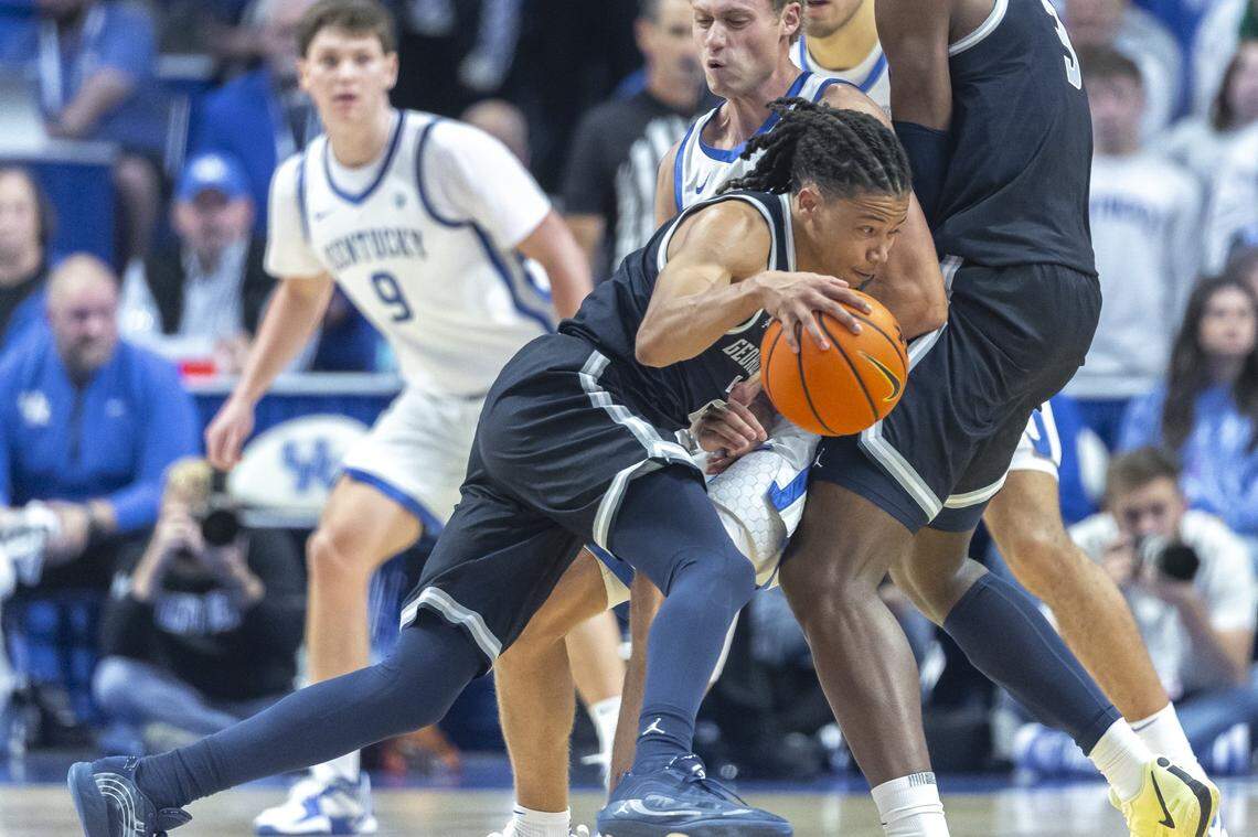 Georgetown uard Mgalik Mack (2) drives the ball as Kentucky guard Collin Chandler (5) defends during the Hoyas’ exhibition win Thursday at Rupp Arena.
