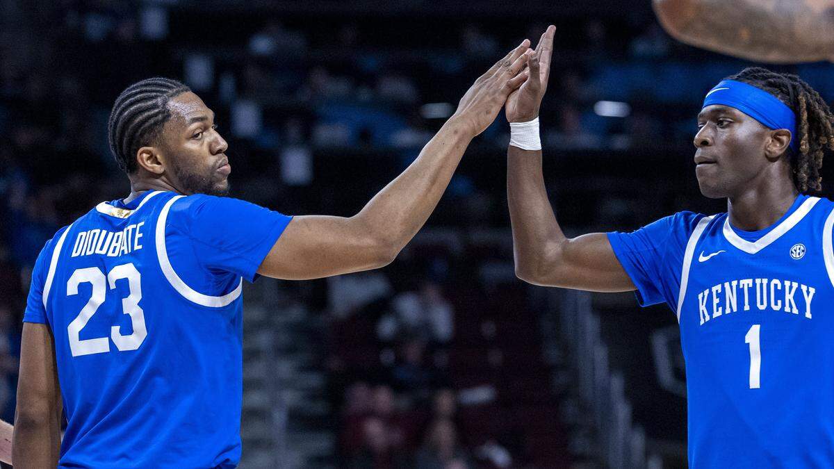 From left, Kentucky Wildcats' forward Mouhamed Dioubate (23) and Kentucky Wildcats' guard Denzel Aberdeen (1) celebrate a second-half basket by Dioubate during a UK’s 72-63 win over South Carolina, Tuesday, Feb. 24, 2026 at Colonial Life Arena in Columbia, SC.