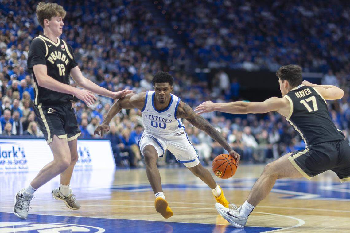 Kentucky guard Otega Oweh drives the ball past two Purdue defenders during an exhibition game in Rupp Arena on Oct. 24.