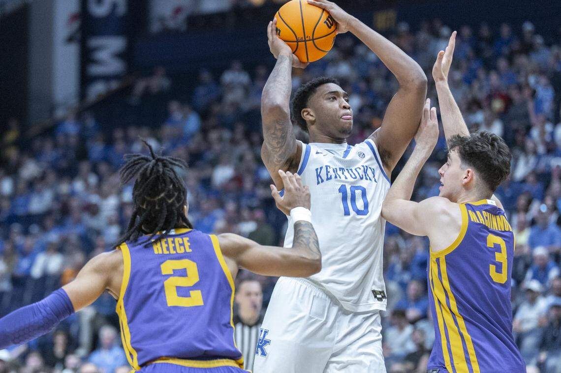 Kentucky Wildcats forward Brandon Garrison (10) shoots the ball as Louisiana State Tigers guard Max MacKinnon (3) defends during the SEC Tournament at Bridgestone Arena in Nashville, Tenn., on Wednesday. 