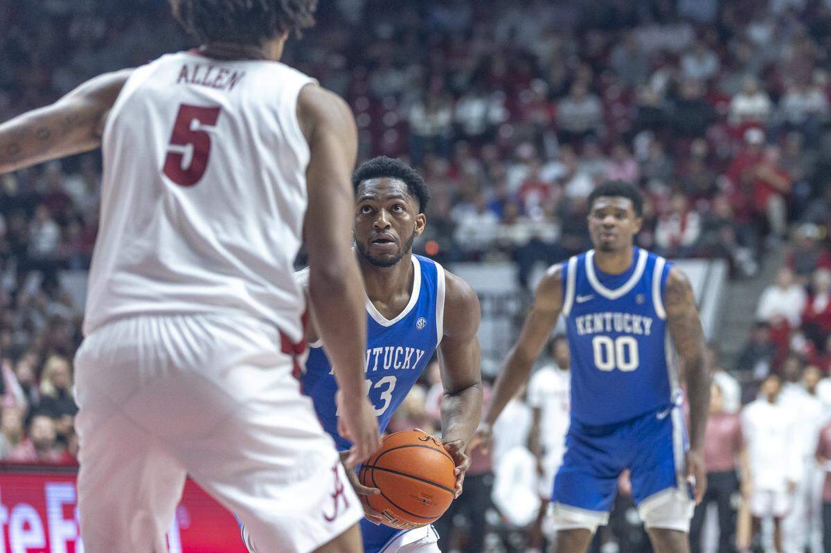 Kentucky forward Mouhamed Dioubate looks to shoot the ball against Alabama as teammate Otega Oweh looks on in the background.