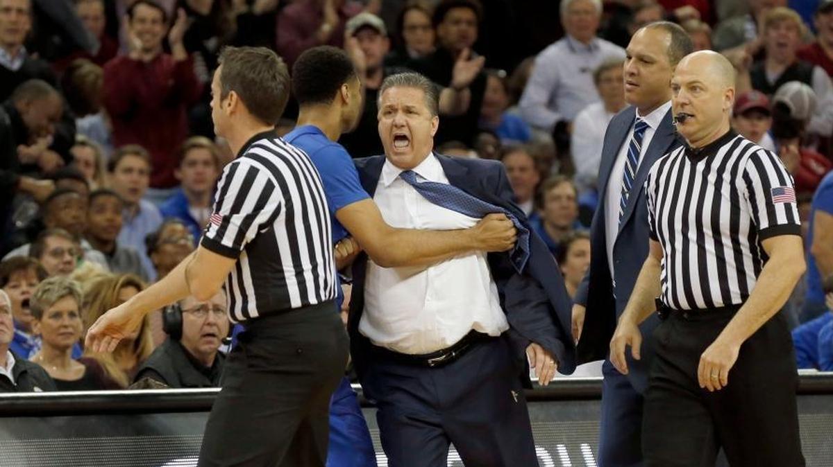Kentucky head coach John Calipari has been ejected on two of the Wildcats’ last three visits to South Carolina, where UK will take on the Gamecocks on Tuesday night. Here, in 2016, referee Doug Sirmons, left, ejected Calipari, who was being held by UK guard Jamal Murray.