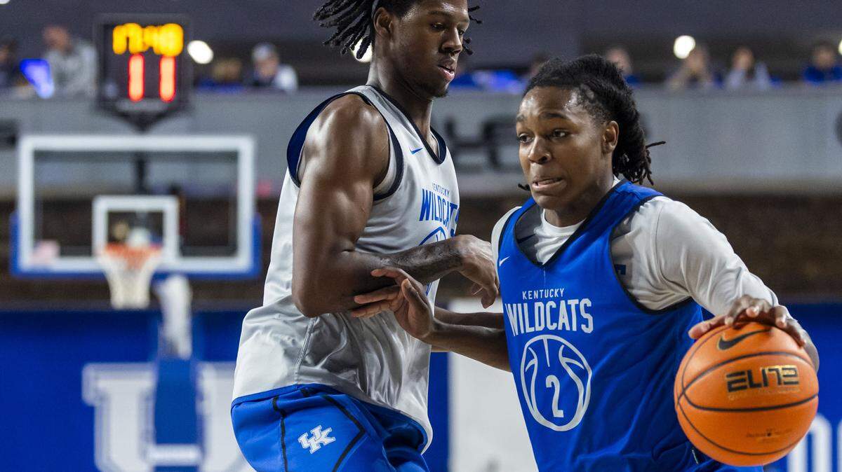 Kentucky guard Jasper Johnson drives on Wildcat teammate Kam Williams during the Blue-White Game on Oct. 17.