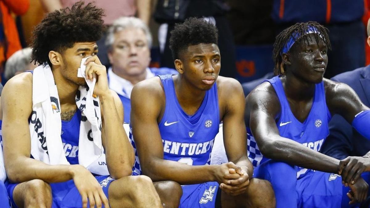 UK’s Nick Richards, left, Hamidou Diallo, center, and Wenyen Gabriel sit on the bench during the second half of the Cats’ loss at Auburn on Wednesday.