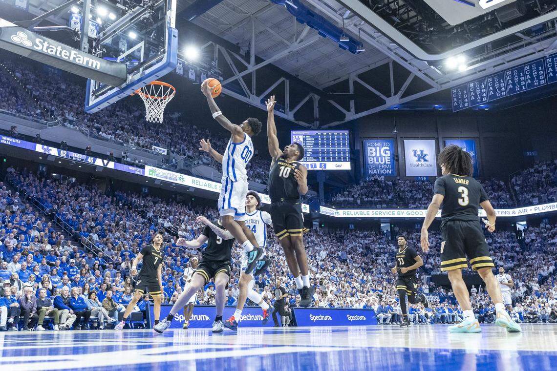 Kentucky Wildcats guard Otega Oweh (00) shoots the ball past Vanderbilt Commodores forward Ak Okereke (10) during a game at Rupp Arena on Saturday.  