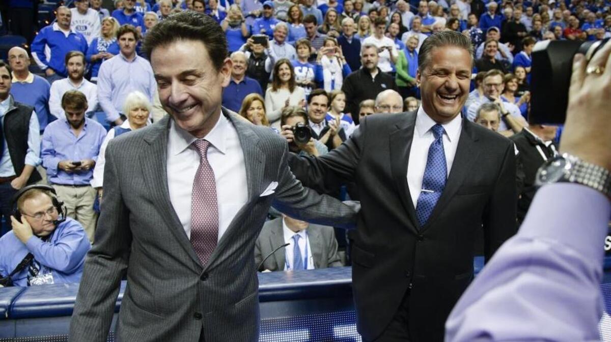 Rick Pitino and John Calipari shared a laugh before Kentucky played Louisville in Rupp Arena in 2015. With his dismissal in the wake of an FBI investigation of college basketball, Pitino will not be part of a UK-U of L game for only the fourth time since 1988.