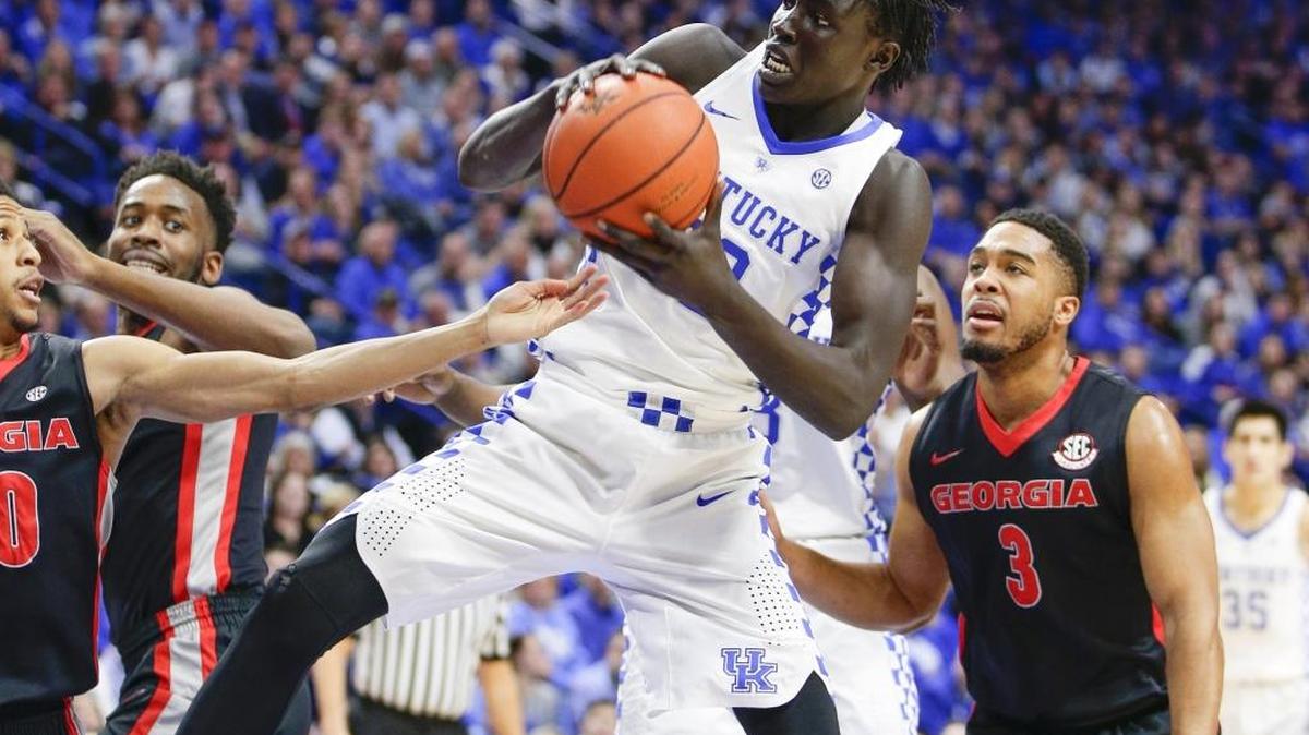 Kentucky Wildcats forward Wenyen Gabriel (32) pulled a rebound in traffic as Kentucky played Georgia on Tuesday January 31, 2017 in Lexington, Ky.