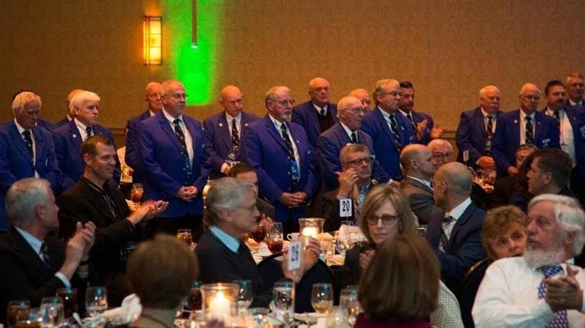Members of UK’s Committee of 101 stood to honor the late Van Florence during the Bluegrass Sports Awards banquet in Lexington on Tuesday.