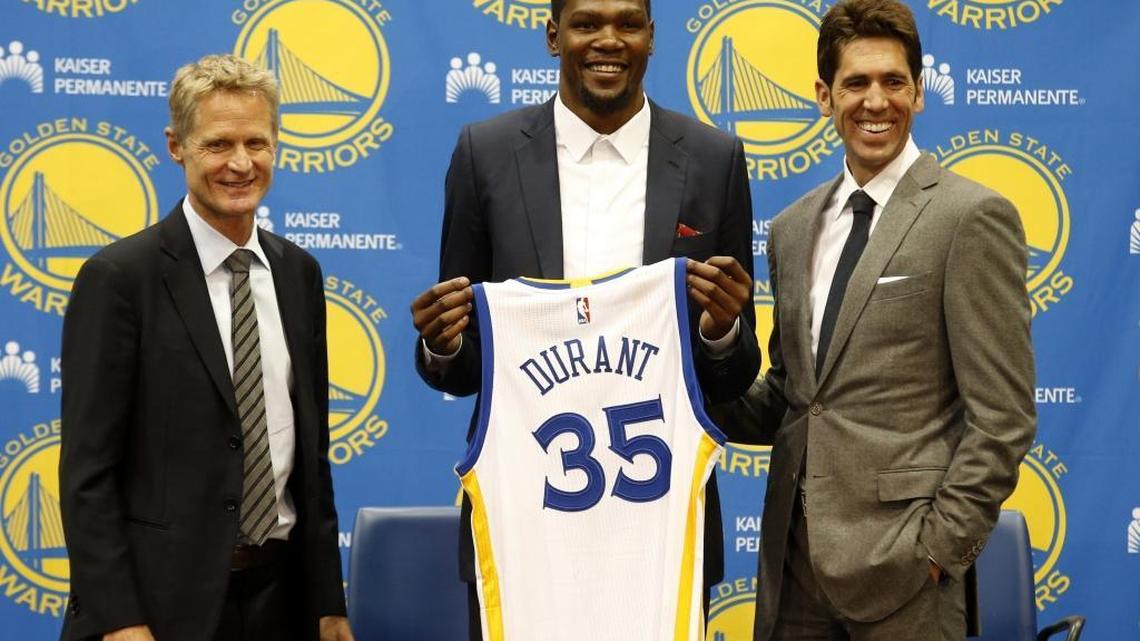 Golden State Warriors’ newcomer Kevin Durant, center, joins head coach Steve Kerr, left, and general manager Bob Myers during a news conference at the team’s practice facility last week.