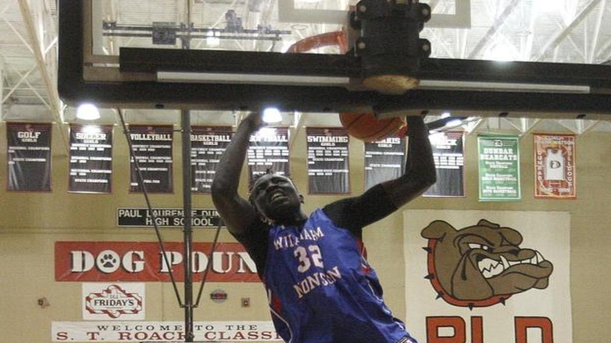 UK signee Wenyen Gabriel of Wilbraham & Monson Academy dunked Saturday night against Athlete Institute during the Bluegrass Showcase at Paul Laurence Dunbar.