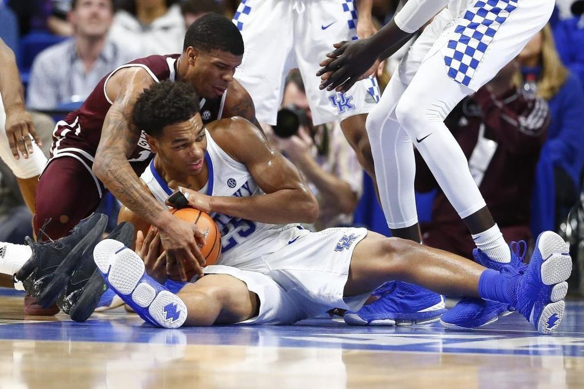 Kentucky forward PJ Washington battled for the ball with Mississippi State guard Lamar Peters in their game in Rupp Arena.