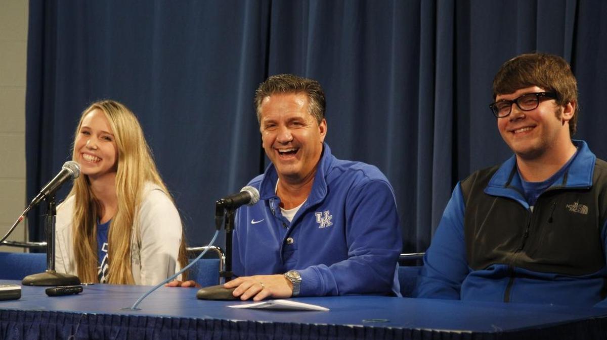 John Calipari awarded free tuition to UK students Amanda Dowell of Stanford and Josh Lawson of Boyle County after UK’s Blue-White Game in 2013.