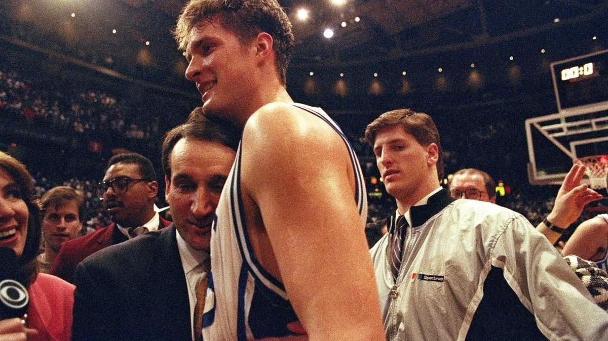 Duke Coach Mike Krzyzewski hugged star center Christian Laettner after Duke defeated Kentucky in overtime 104-103 to win NCAA East Regional finals in Philadelphia on March 30, 1992.