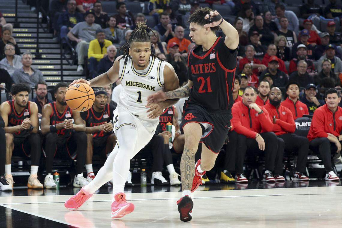 San Diego State’s Miles Byrd, right, earned Mountain West Defensive Player of the Year honors for the 2025-26 season.