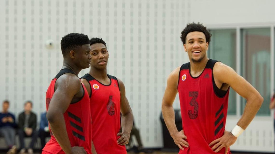 EJ Montgomery, right, talks with Duke commitments Zion Williamson, left, and RJ Barrett and a McDonald’s practice.