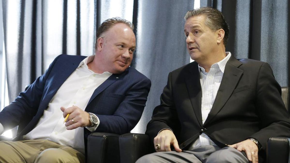 Kentucky football coach Mark Stoops and basketball coach John Calipari attended a uniform unveiling event in the new recruiting room at Commonwealth Stadium on Feb. 5, 2016.