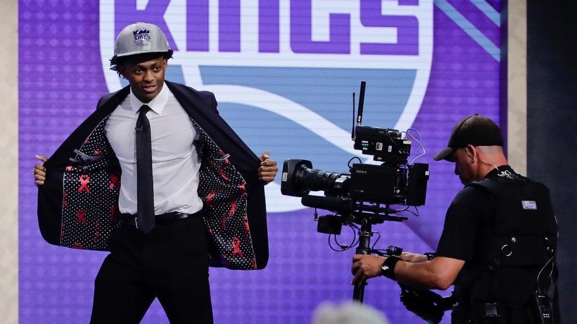 Kentucky's De' Aaron Fox reacts after being selected by the Sacramento Kings as the fifth pick overall during the NBA basketball draft, Thursday, June 22, 2017, in New York. (AP Photo/Frank Franklin II)