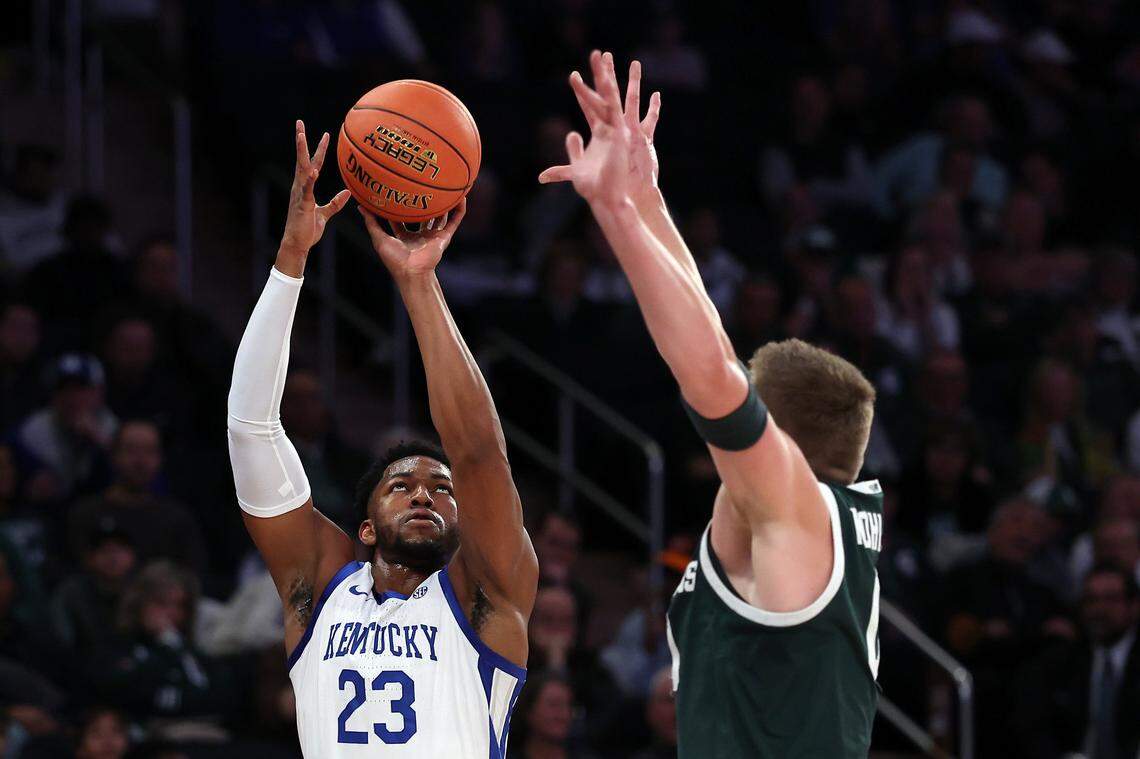 Mouhamed Dioubate attempts a 3-pointer over Michigan State’s Jaxon Kohler during the Champions Classic at Madison Square Garden on Tuesday night. UK was 7 for 30 on 3-pointers in the 83-66 loss.
