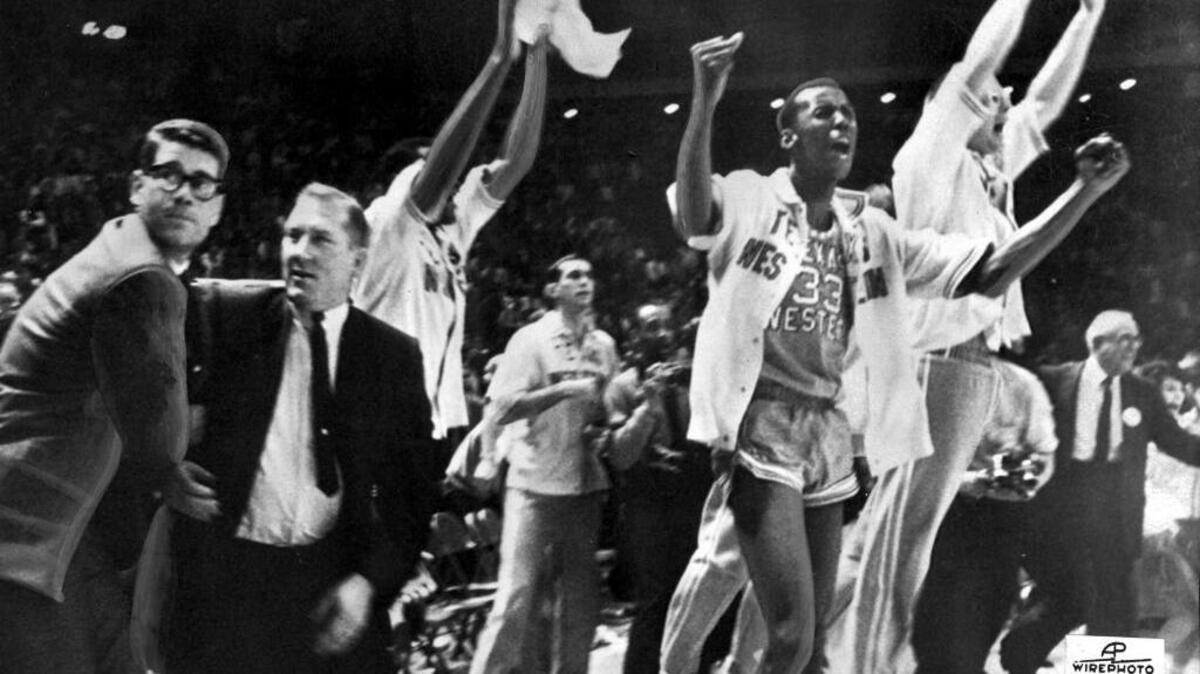 FILE - In this March 19, 1966, file photo, Texas Western basketball coach Don Haskins, second from left, and players celebrate after winning the NCAA basketball championship in College Park, Md. Fifty years ago, Texas Western started five blacks–Willie Worsley, Orsten Artis , Bobby Joe Hill, David "Big Daddy" Lattin and Harry Flournoy–against Kentucky in the NCAA championship game. Today, after reading historical recaps and watching movies, people tend to think it was an immediate watershed moment in sports and civil rights. It wasn't.
