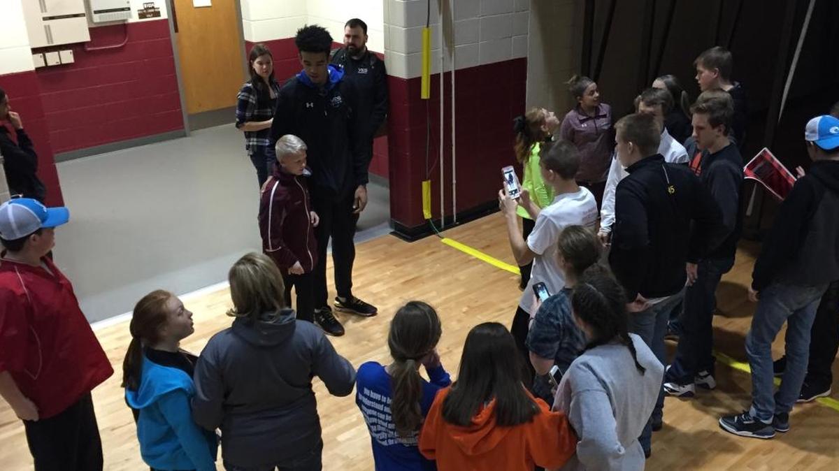 Several kids waited to get their pictures taken with UK basketball signee Sacha Killeya-Jones after he played a game Saturday night at Pulaski County High School in Somerset.