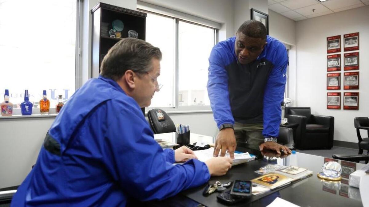 DeWayne Peevy, Deputy Director of Athletics at UK, chatted with UK men’s basketball coach John Calipari in his office on Jan. 27, 2015.