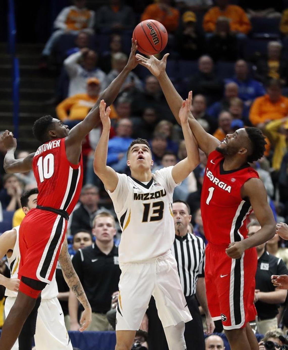 Missouri’s Michael Porter Jr. reached for a rebound between Georgia’s Teshaun Hightower (10) and Yante Maten (1) during Thursday’s SEC Tournament game in St. Louis. Porter Jr. played Thursday for the first time since early this season after returning from back surgery.