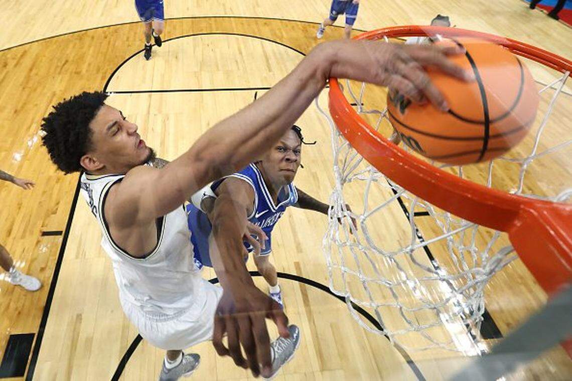 Michigan forward Yaxel Lendeborg dunks against Saint Louis in the second round of the 2026 NCAA Tournament at KeyBank Center in Buffalo, New York, on Saturday. Lendeborg told The Associated Press that he received an NIL offer worth between $7 million and $9 million to play at Kentucky, but UK coach Mark Pope denied that Monday.