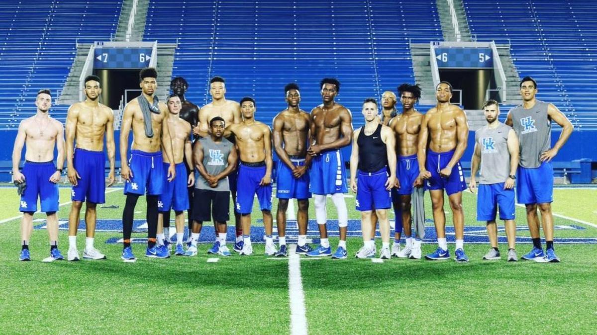 The Kentucky men’s basketball team posed for a post-workout photo under the lights at Kroger Field late Wednesday night.