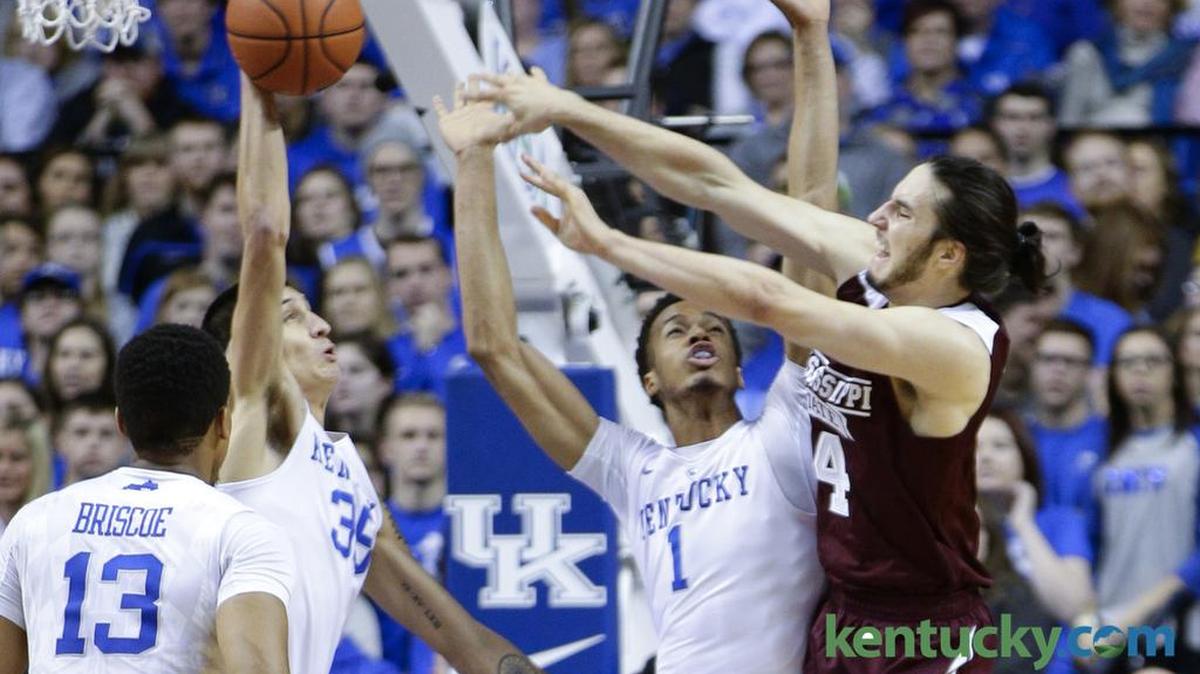Mississippi State Bulldogs forward Johnny Zuppardo (4) lost the ball under the basket as he tried to pass over Kentucky Wildcats forward Derek Willis (35).