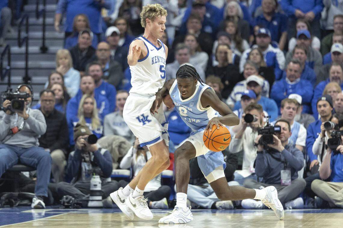 North Carolina forward Caleb Wilson (8) drives the ball as Kentucky guard Collin Chandler (5) defends during a game at Rupp Arena in Lexington, Ky., on Tuesday.
