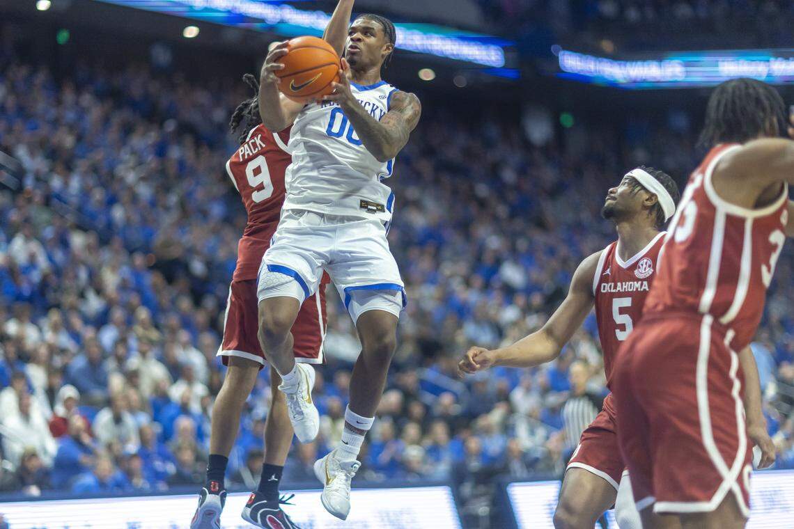 Kentucky Wildcats guard Otega Oweh (00) shoots the ball past Oklahoma Sooners guard Nijel Pack (9) during a game at Rupp Arena on Wednesday.