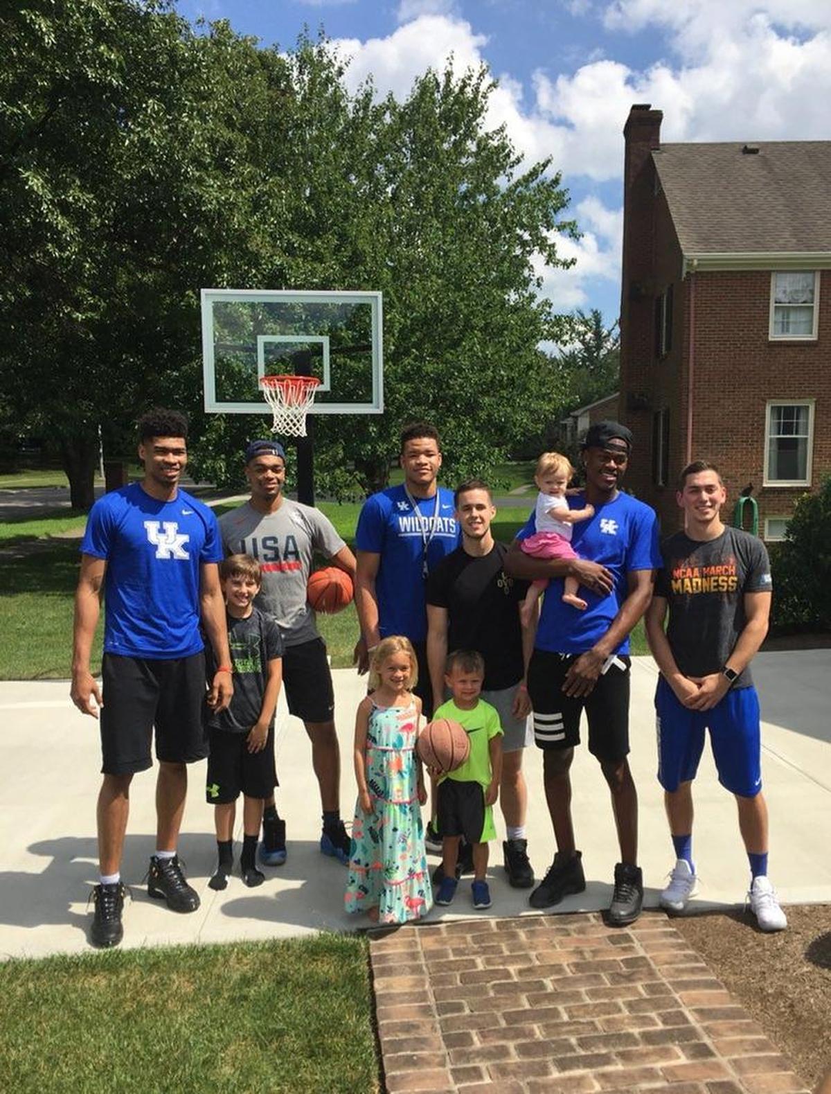 UK players Nick Richards, PJ Washington, Kevin Knox, Brad Calipari, Jarred Vanderbilt and Jonny David were caught in the act by a Lexington family as they completed the Drive-by Dunk Challenge.
