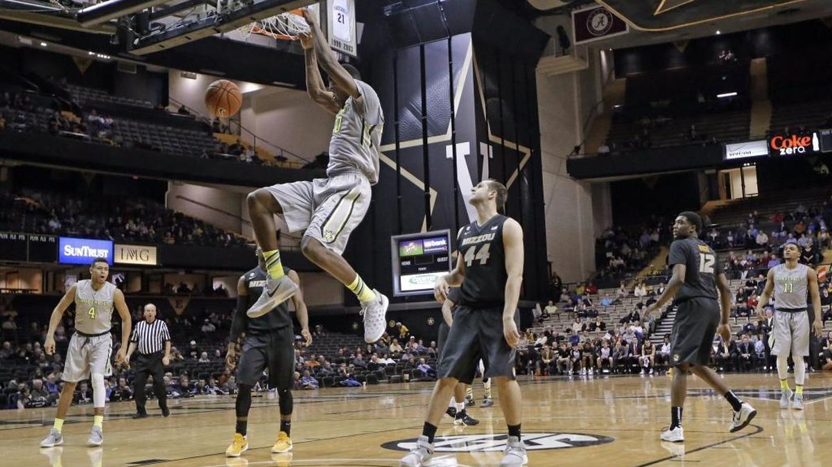 Vanderbilt center Damian Jones dunks the ball in front of Missouri forward Ryan Rosburg (44) in the second half of an NCAA college basketball game Wednesday, Feb. 10, 2016, in Nashville, Tenn. Vanderbilt won 86-71.