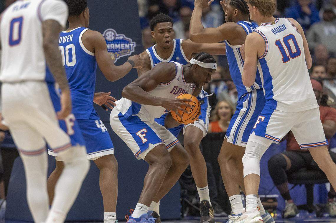 Florida center Rueben Chinyelu (9) grabs a rebound against Kentucky during the Gators’ win Friday in the SEC Tournament at Bridgestone Arena in Nashville, Tennessee. 