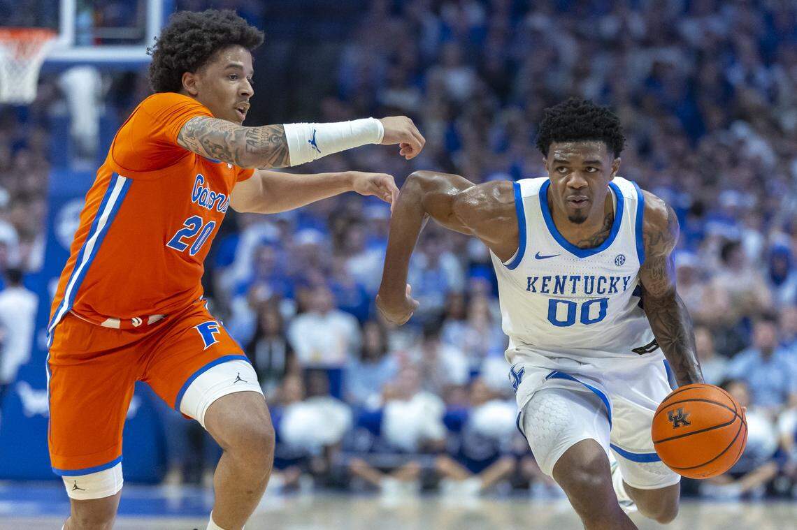 Kentucky Wildcats guard Otega Oweh (00) drives the ball as Florida Gators guard Isaiah Brown (20) defends during a game at Rupp Arena on Saturday. 