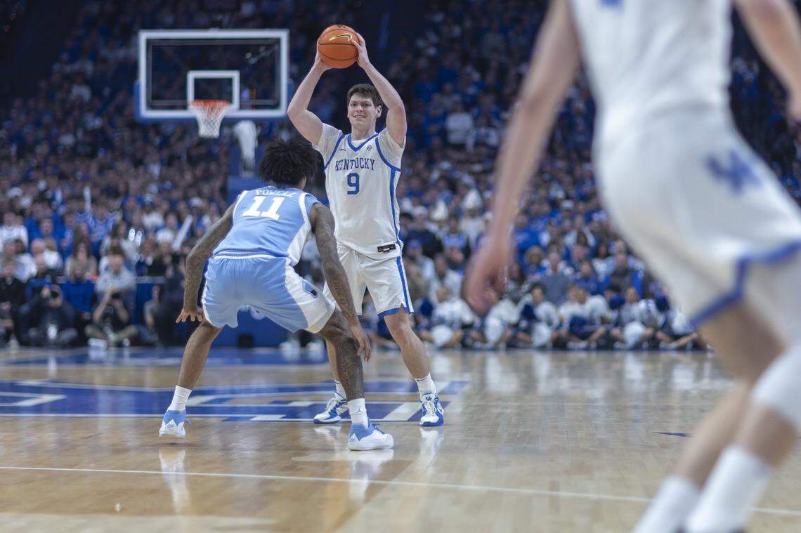 Kentucky basketball forward Trent Noah (9) looks to move the ball as North Carolina forward Jonathan Powell (11) defends during a game at Rupp Arena on Tuesday.