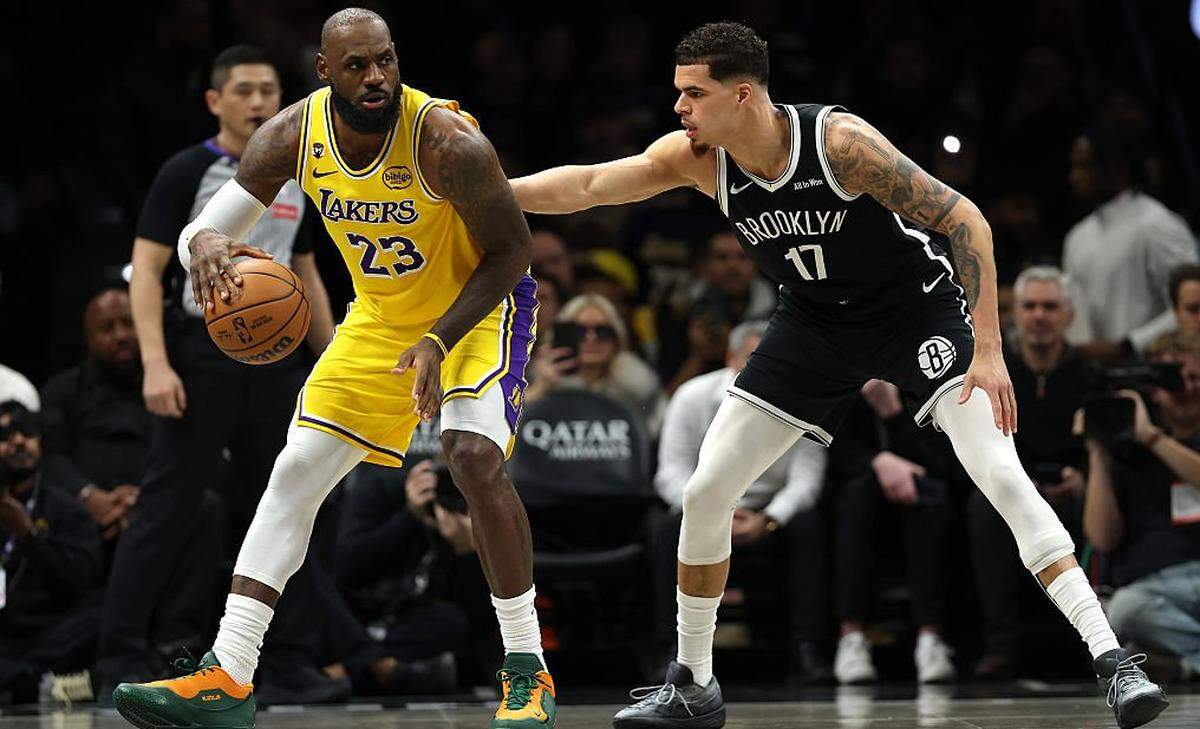 Los Angeles Lakers star LeBron James, left, has worn several different college versions of his Nike LeBron 23 PE shoes in recent weeks. The schools represented have included Duke, Florida A&M, Kentucky, Oregon and Southern California.