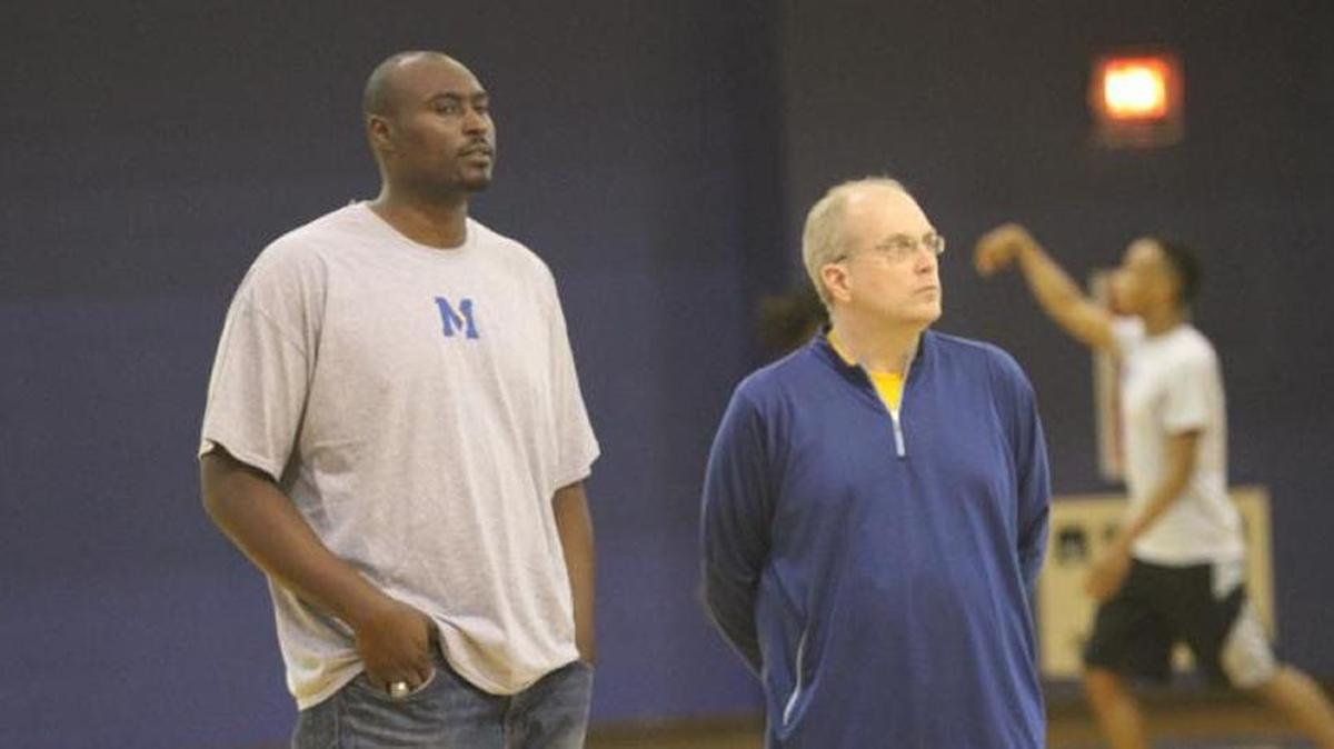 Marquis Estill, left, joined head coach Joe Krupinski in a recent Midway University practice