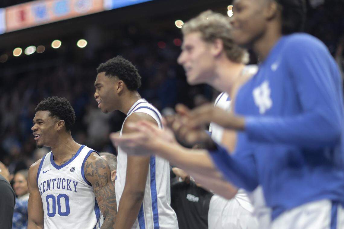 Kentucky players Otega Oweh, from left, Brandon Garrison, Collin Chandler and Jasper Johnson cheer from the bench during the Wildcats’ victory over St. John’s.