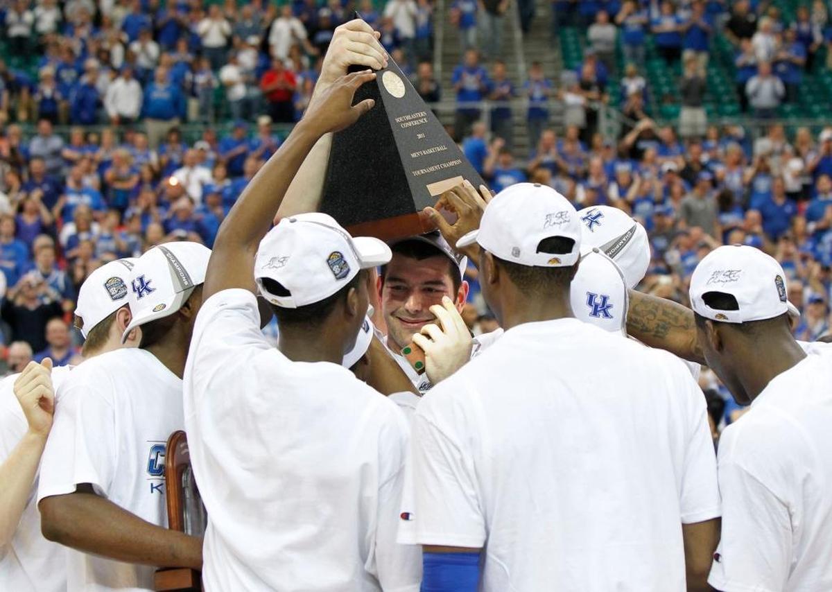 Kentucky celebrated with the SEC Tournament championship trophy after the Cats defeated Florida 70-54 in the SEC finals on in Atlanta in 2011.