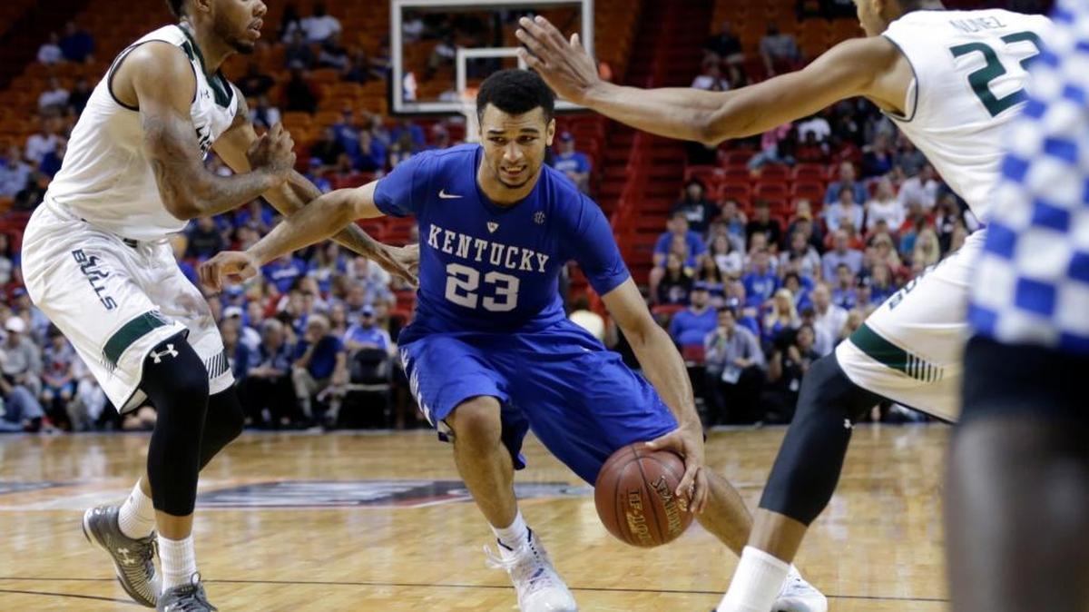 UK freshman guard Jamal Murray (23) drove against South Florida’s Roddy Peters, left, and Angel Nunez.