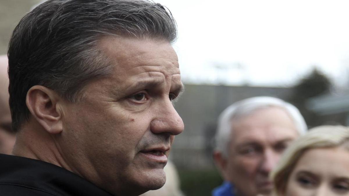Kentucky head coach John Calipari answers questions from the media in his backyard after viewing the NCAA basketball selection show at his home, Sunday, March 12, 2017, in Lexington, Ky. (AP Photo/James Crisp)